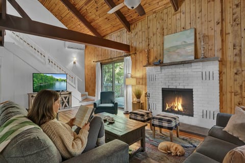 Cozy up by the fireplace, watch TV, and enjoy our open family room!