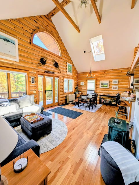 Spacious open floor plan with fireplace, vaulted ceilings and natural light.