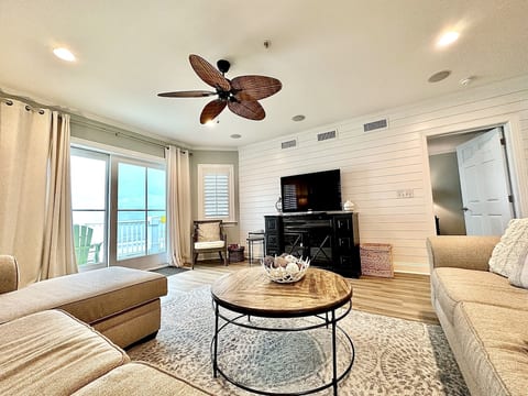 Living Room with ample comfort seating and flat-screen television #301 Dunescape, Isle of Palms, SC | IOP Escapes