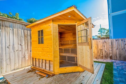 Unwind in your own private cedar sauna—just steps from the pool. The perfect way to relax after a day at the beach.