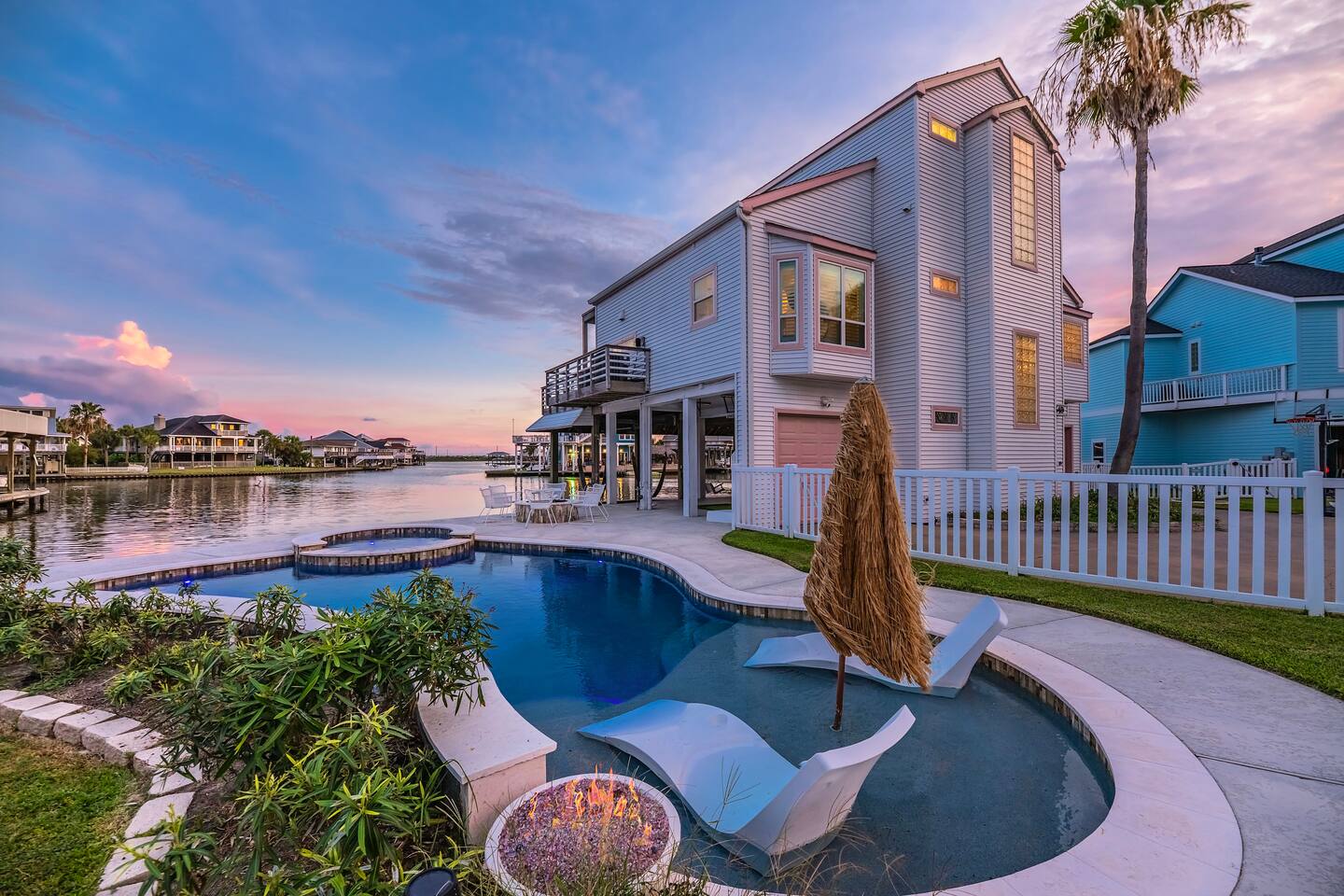 Luxury waterfront oasis with a private pool, in-water loungers, and breathtaking sunset views. The perfect spot to relax, unwind, and enjoy coastal living at its finest.