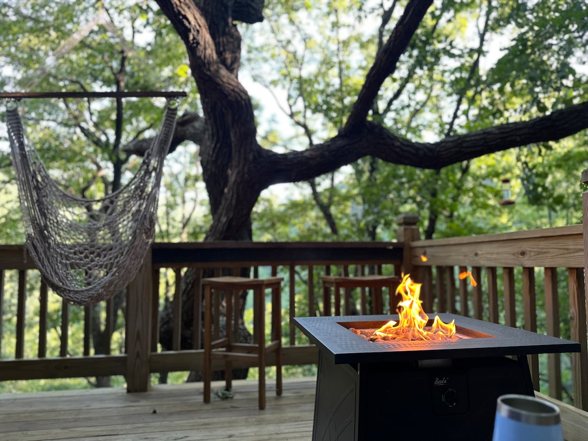 “ The porch is so inviting and the sound of the Waterfall was so peaceful. The home is beautiful and well equipped. We enjoyed the peaceful and relaxing atmosphere” 

Firepit table, hammock swing, Adirondacks,  grill & bar overlooking the waterfall