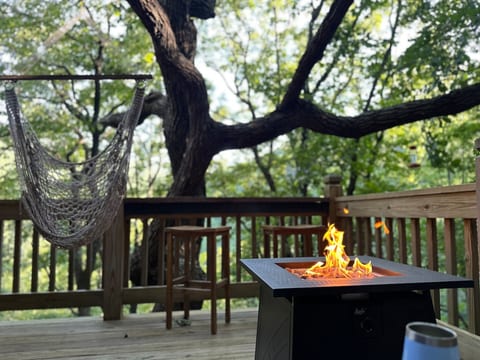 “ The porch is so inviting and the sound of the Waterfall was so peaceful. The home is beautiful and well equipped. We enjoyed the peaceful and relaxing atmosphere”
Firepit table, hammock swing, Adirondacks, grill & bar overlooking the waterfall