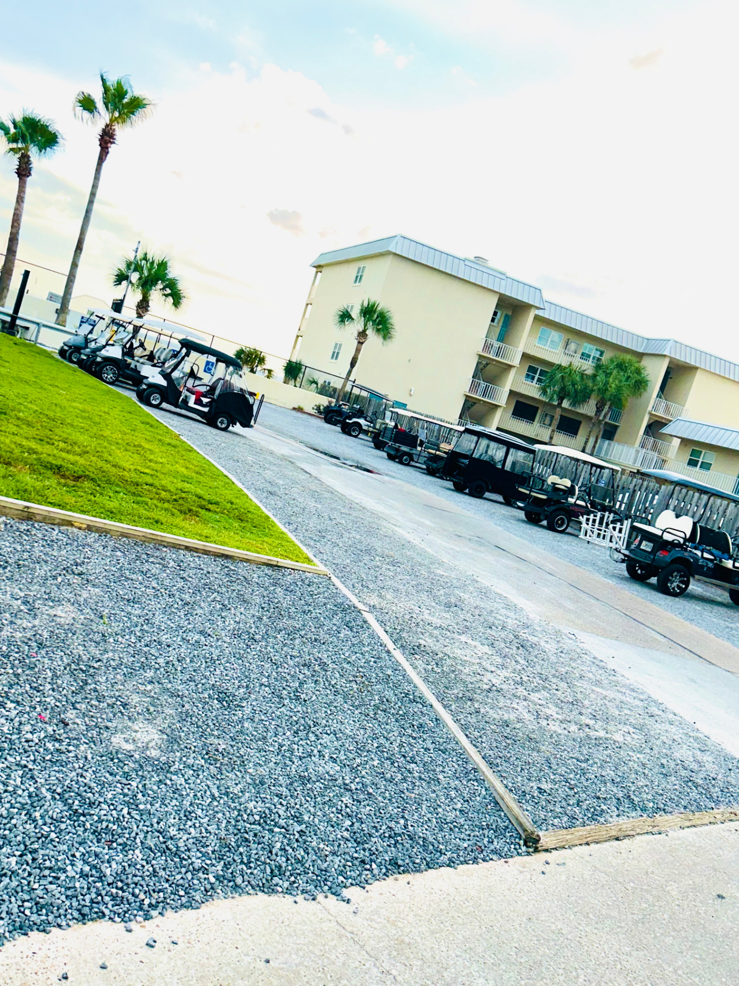 Golf cart parking by the beach and pool