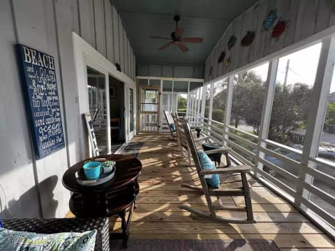 Large screened in rocking chair front porch