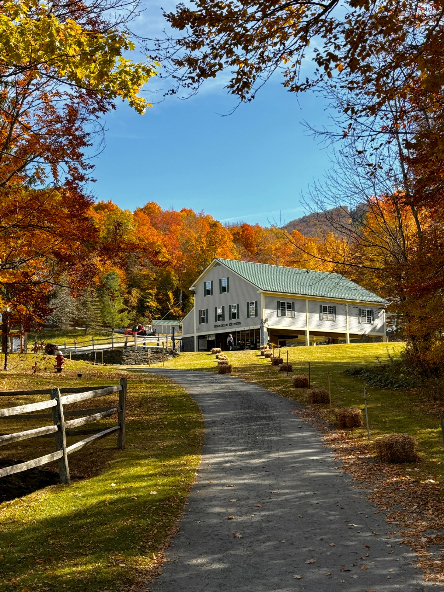 Berkshire Express lift at Jiminy Peak, surrounded by peak fall foliage and mountain views.