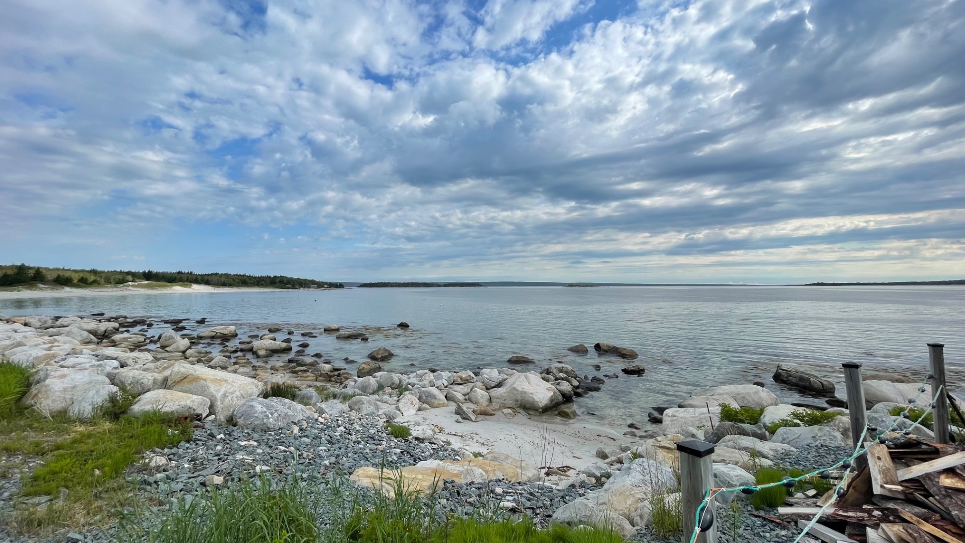 Rock stairs to sandy area directly from the property