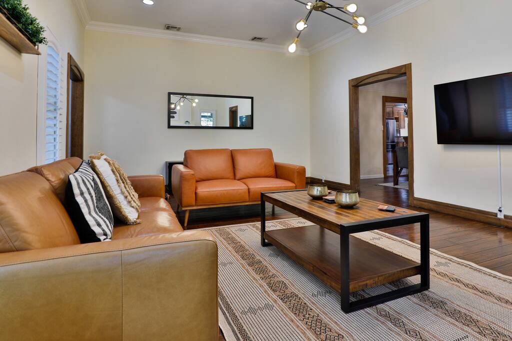 Inviting living area with ample room for relaxation and socializing with friends in a comfortable ambiance.