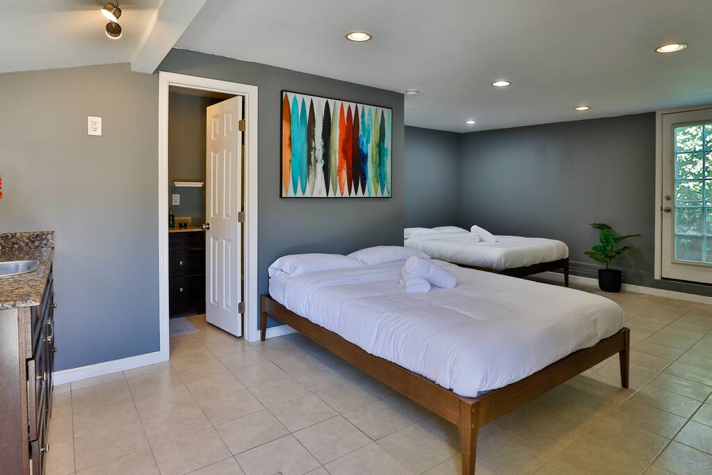 Spacious and welcoming guest room with two comfortable double beds for your convenience.