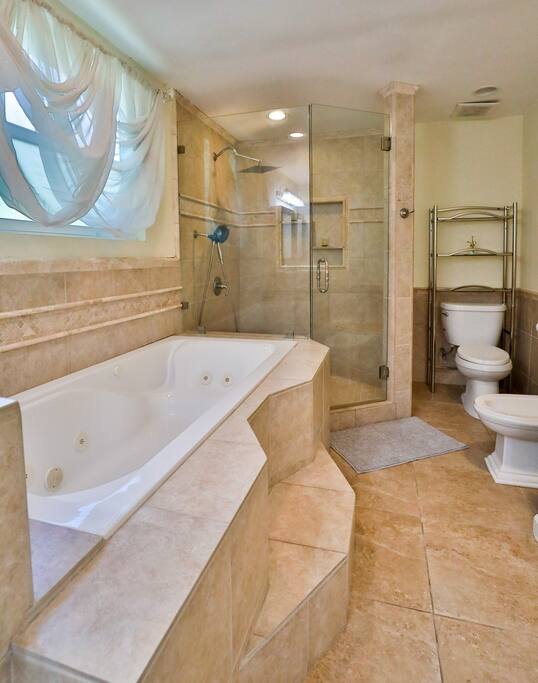 Experience the luxury of a generously-sized bathroom with a generously-sized shower, and abundant natural light. Discover a haven of comfort and sophistication during your stay room.