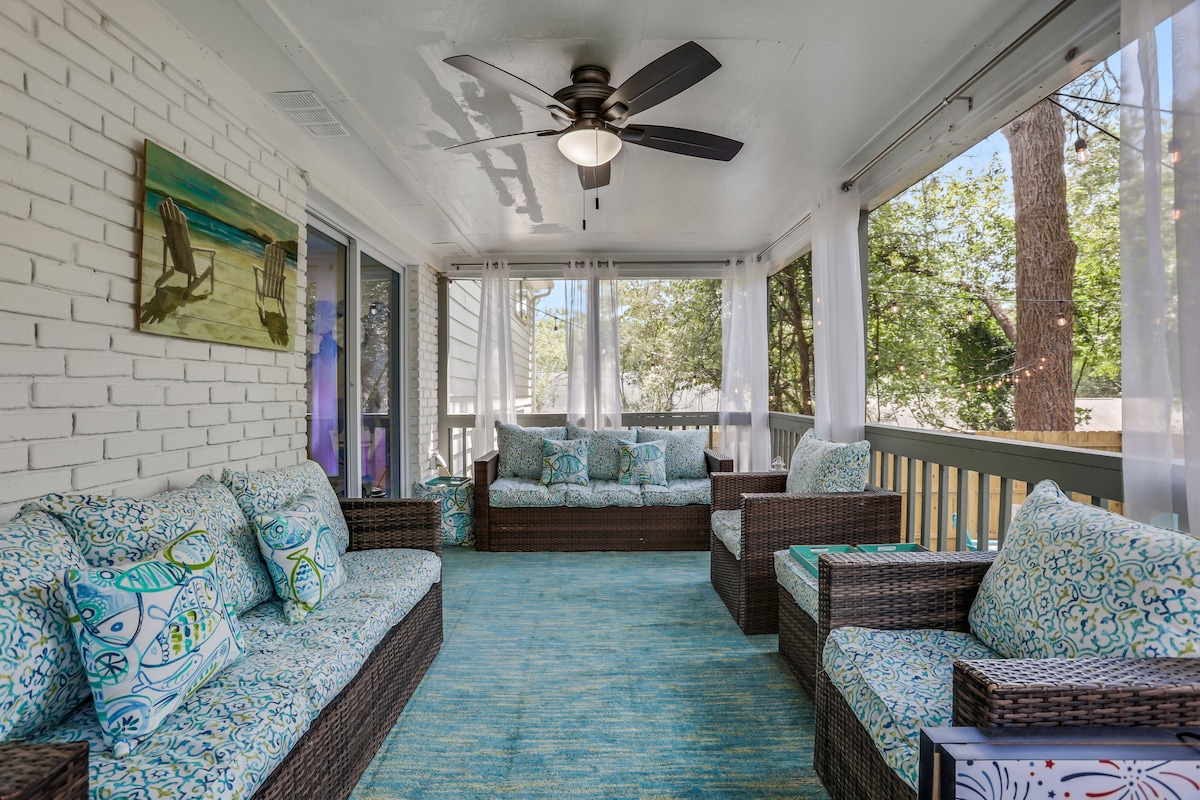 Relax on the screened-in backyard Deck, with comfortable seating and a peaceful view.