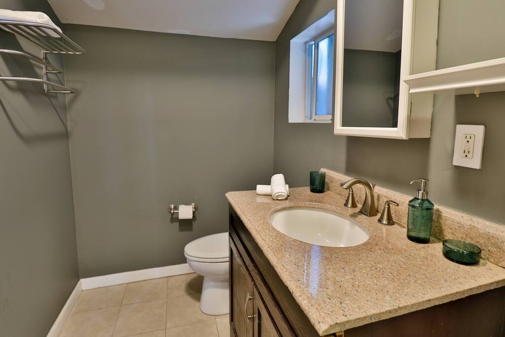Guest house bathroom, with a tub and sink.