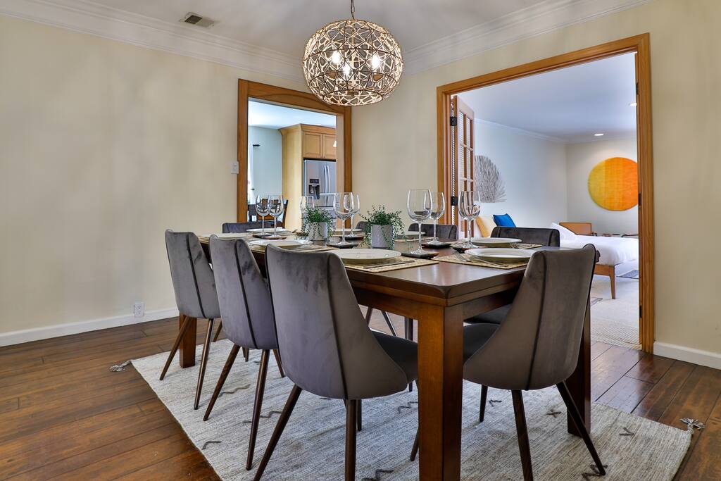 Generous dining area with breathtaking outdoor vistas, perfect for hosting exceptional meals and family or friend gatherings.