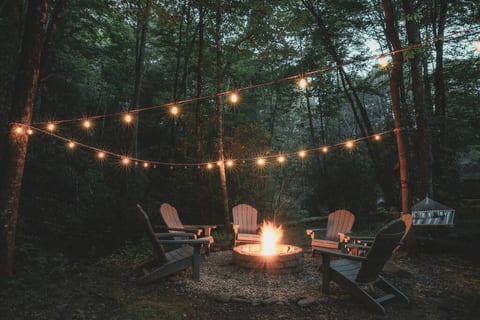 This fire pit is right next to the creek right out the back door. There is also a picnic table, park bench, 2 person hammock, and a corn hole game.