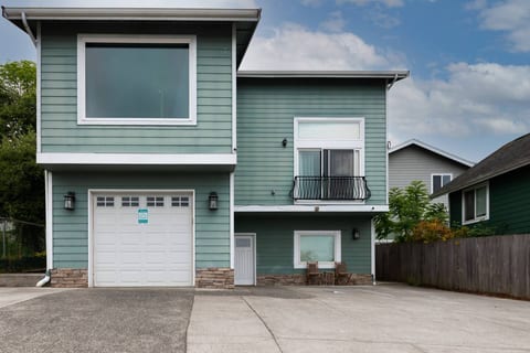 Exterior front of the house, your unit's entrance is the white door. 