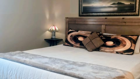 Comfy king bed in bedroom to rest and relax after a day of fun!