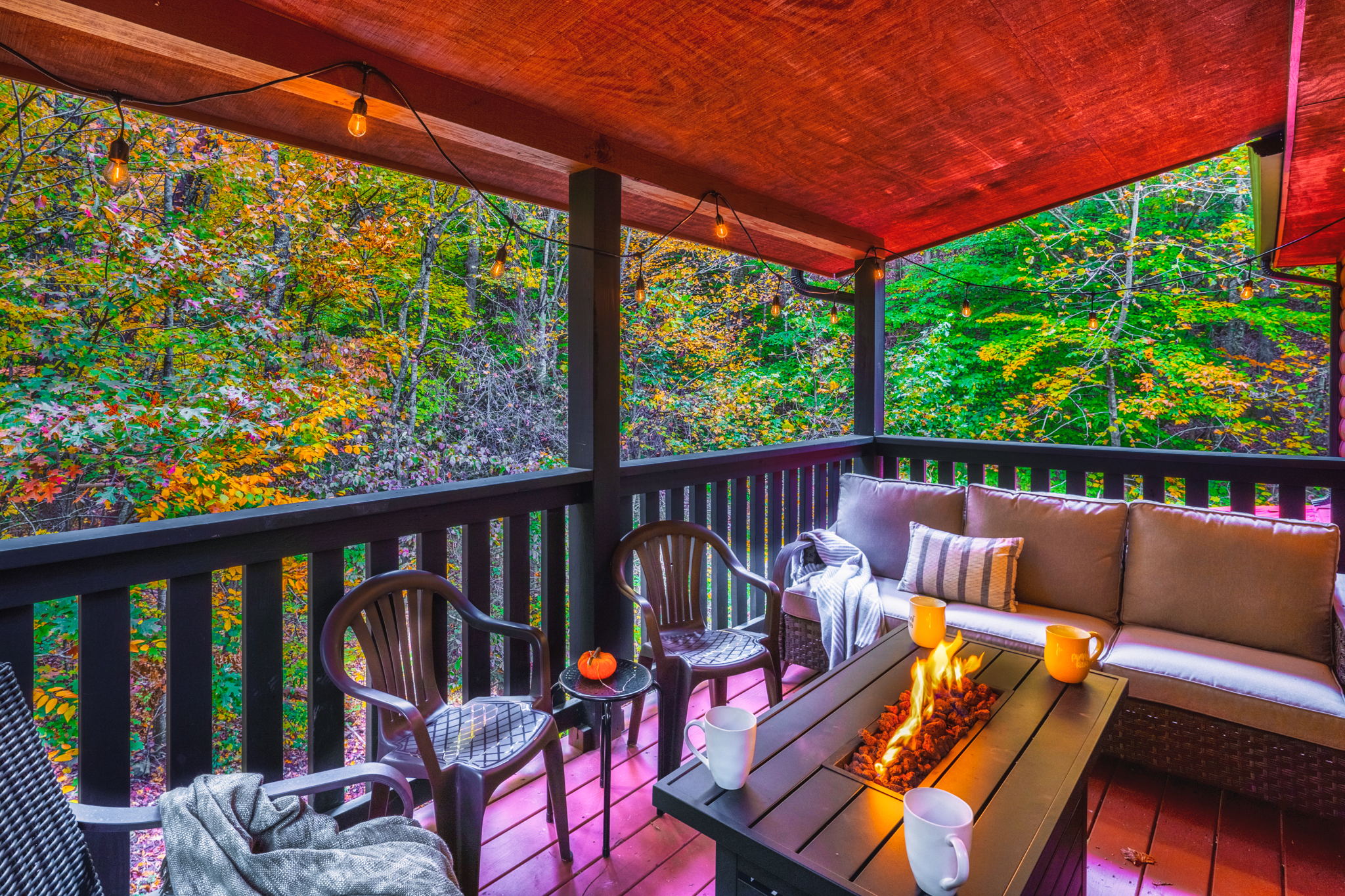 Enjoy the changing colors on the back balcony with fire table and plenty of seating.  Follow us on our IG for more photos and videos @GrandviewHolidays