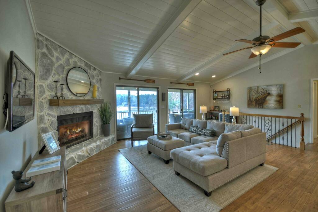 Ship lap vaulted ceilings, incredible mountain and lake views & professionally decorated! 