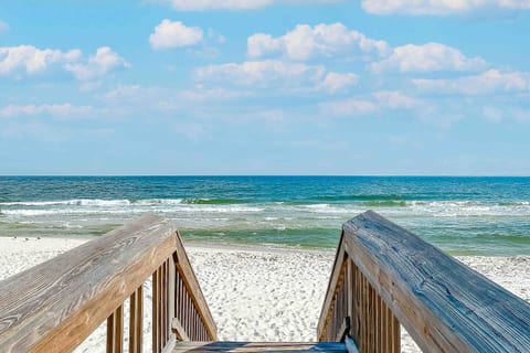 Short 100 feet walk to the public entrance to beach public at lifeguard station #10.  Outdoor showers and restrooms open also at this cross walk