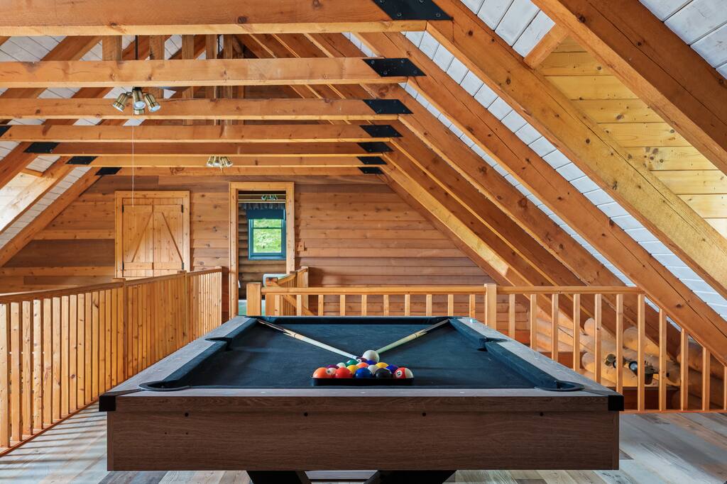 Newly added Pool table in the upstairs open loft is great for friends and family to enjoy with windows that overlook the property on both sides.  The pool table also has a TV wall mounted.