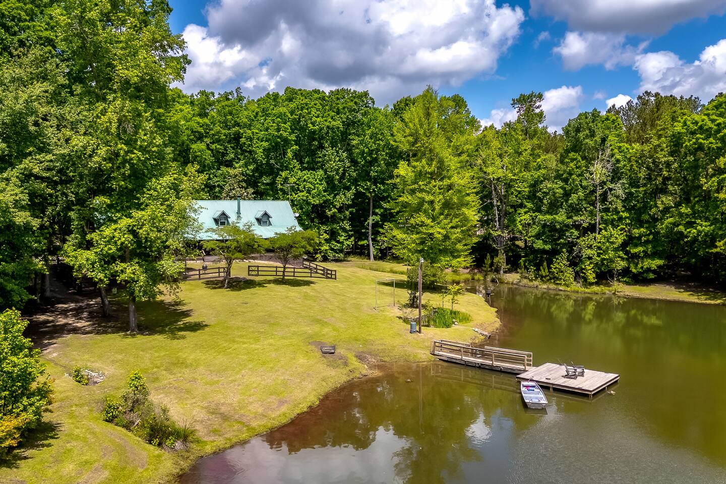 The Moonlight Lodge over looks a private lake fully stocked with Bass, Striper, Blue Gil and Carp for fishing, swimming and relaxing.  Out newly built dock has a metal boat for guest use to fish and explore the property.  