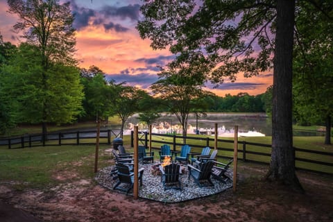 Sunsets year round with seating for up to 14 people at the rustic style firepit.  Perfect for smores and telling campfire stories, the fenced yard overlooks the private Lake 