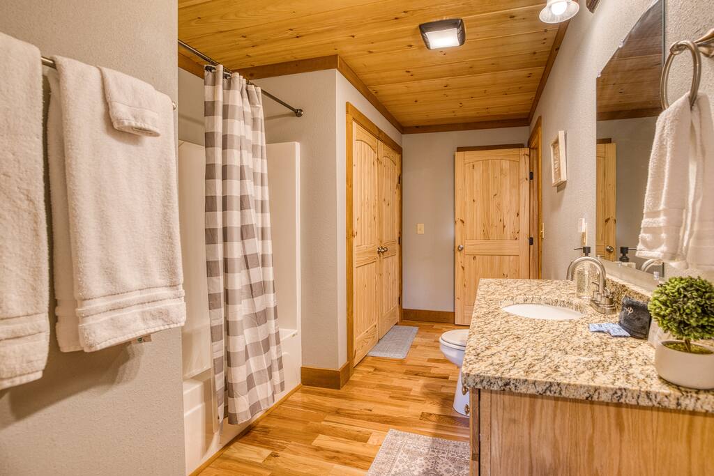 Main floor bathroom has two entrances one from bedroom and the other from kitchen. Also included is a full size washer and dryer 