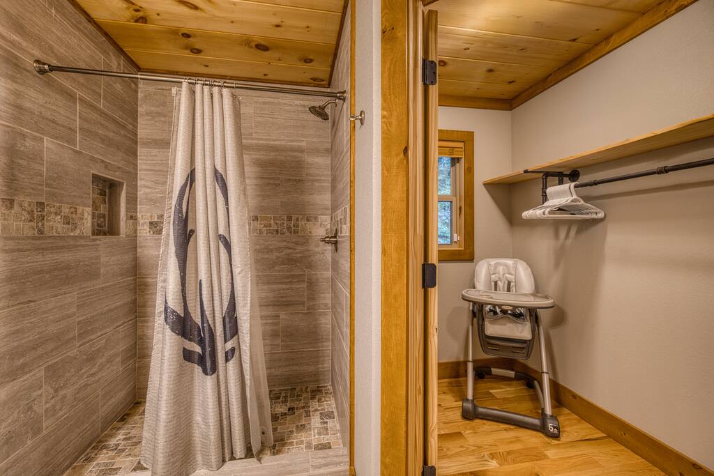 Large walk in shower attached to main floor en-suite king bedroom. Walk in closet and storage for high chair.
