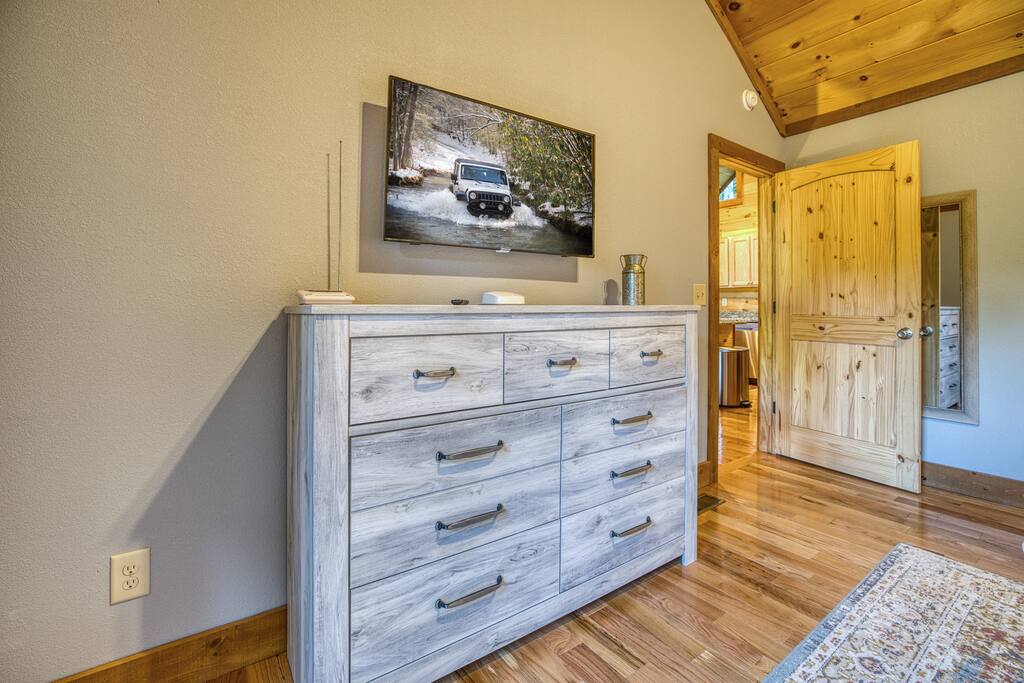 Great high quality furnishings throughout every room with tall dresser to hold clothing (main floor king bedroom). Flat screen television has smart apps for all your favorite shows if you choose to stay in bed and get some extra rest 