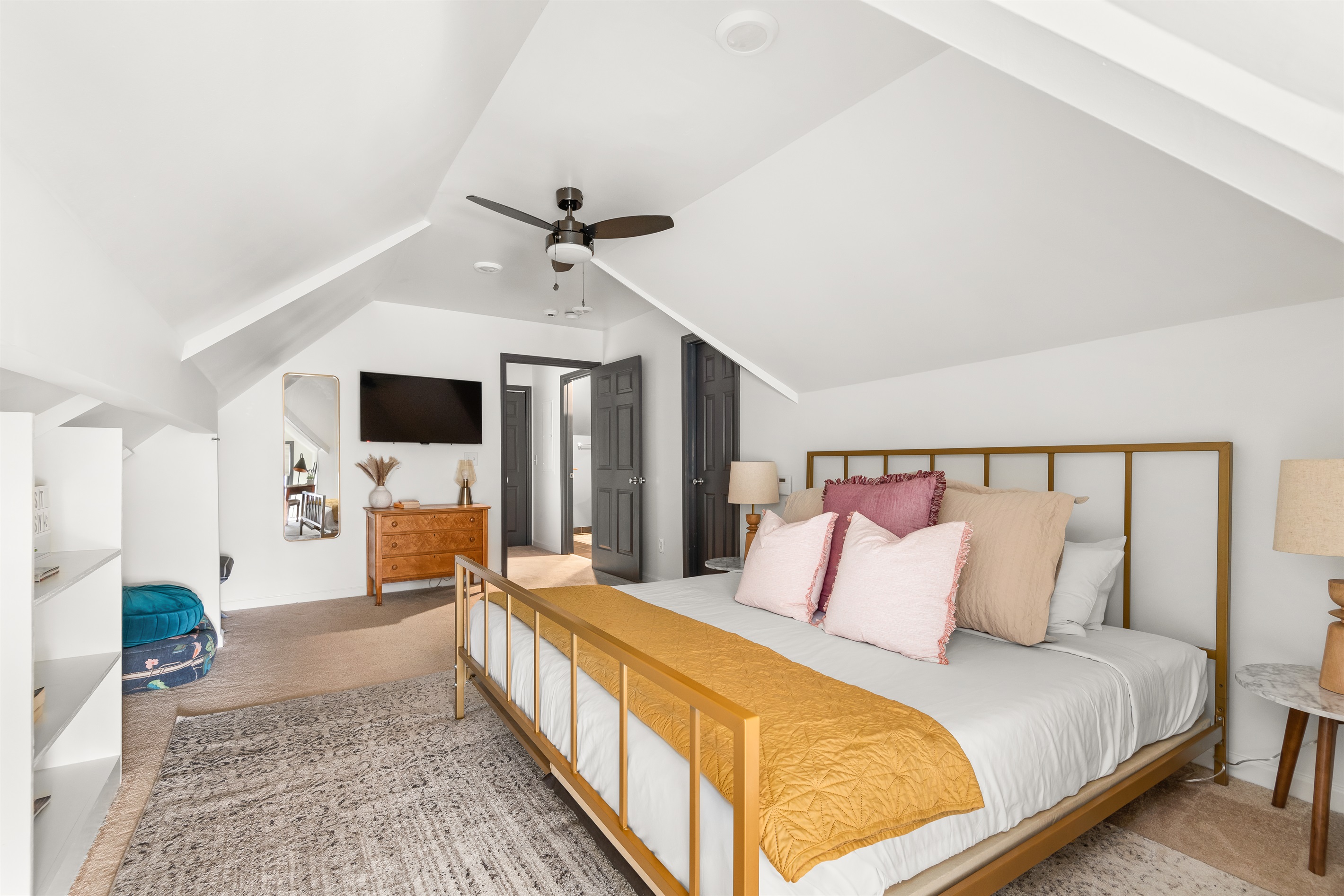 The spacious bedroom has a king-size bed