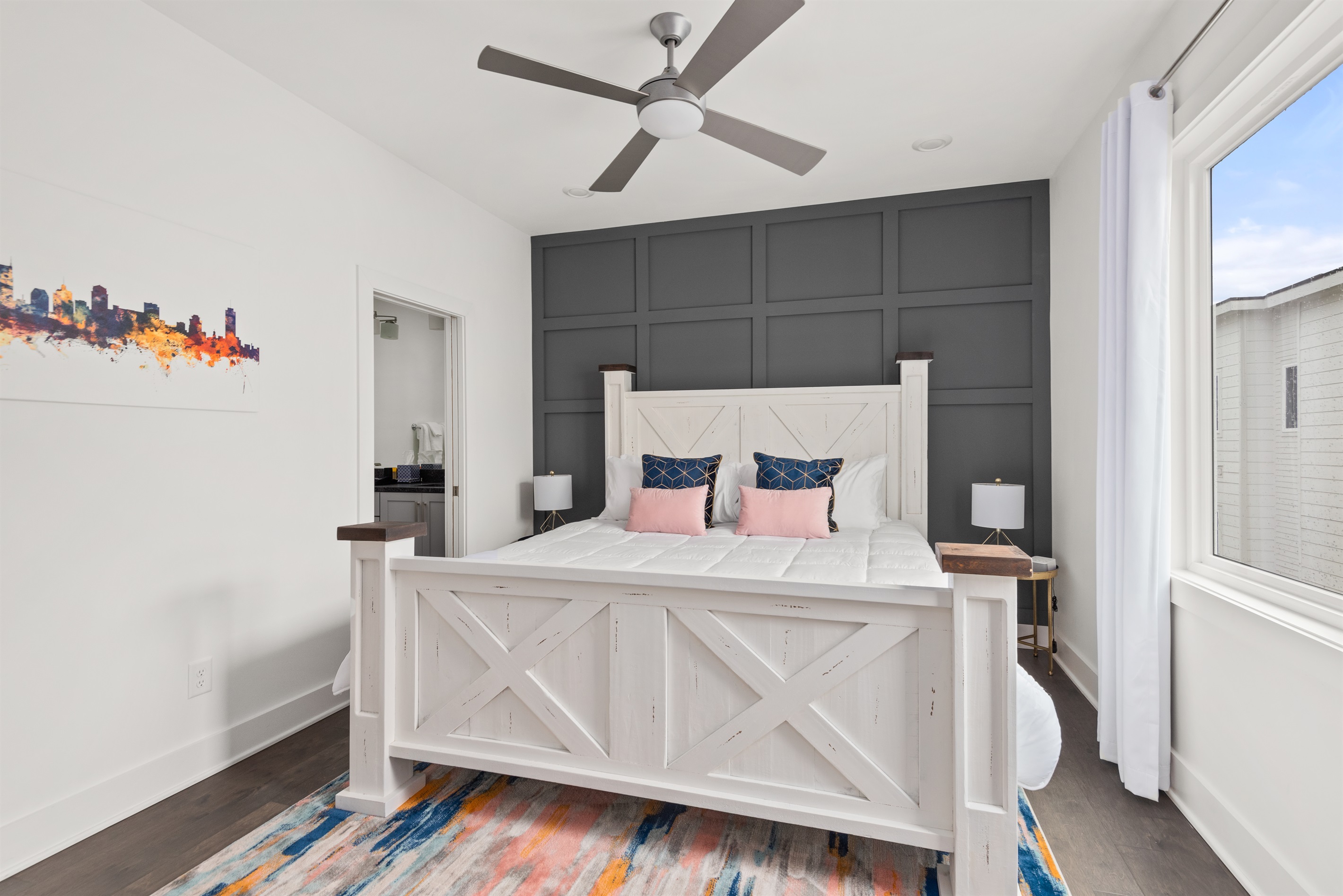 King bed in the master bedroom, with ensuite bathroom