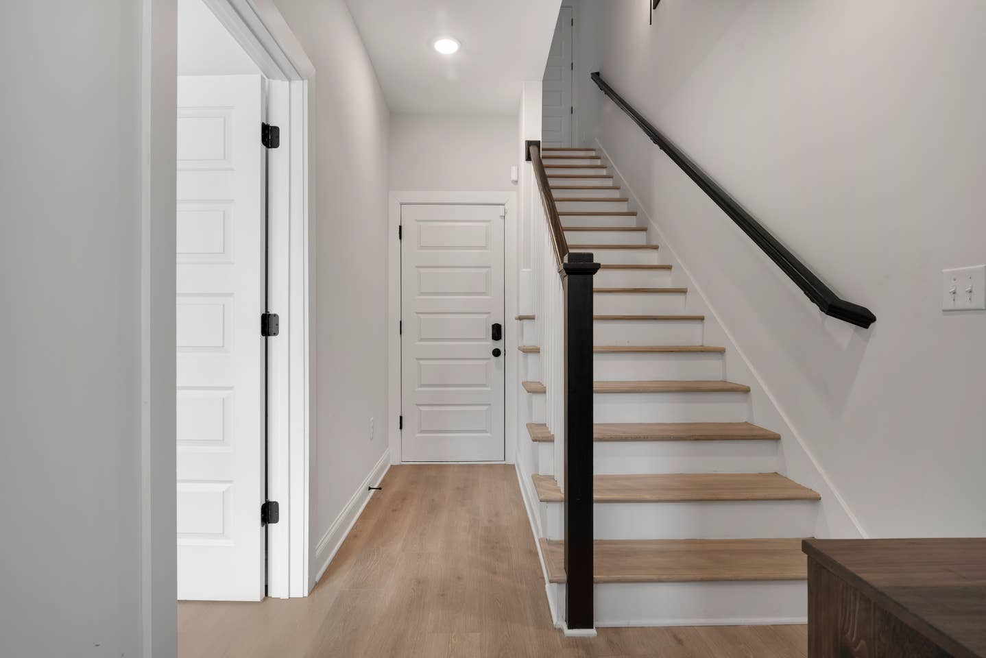 Enter from the garage and either climb the steps to upstairs or pop your head in Bedroom 1