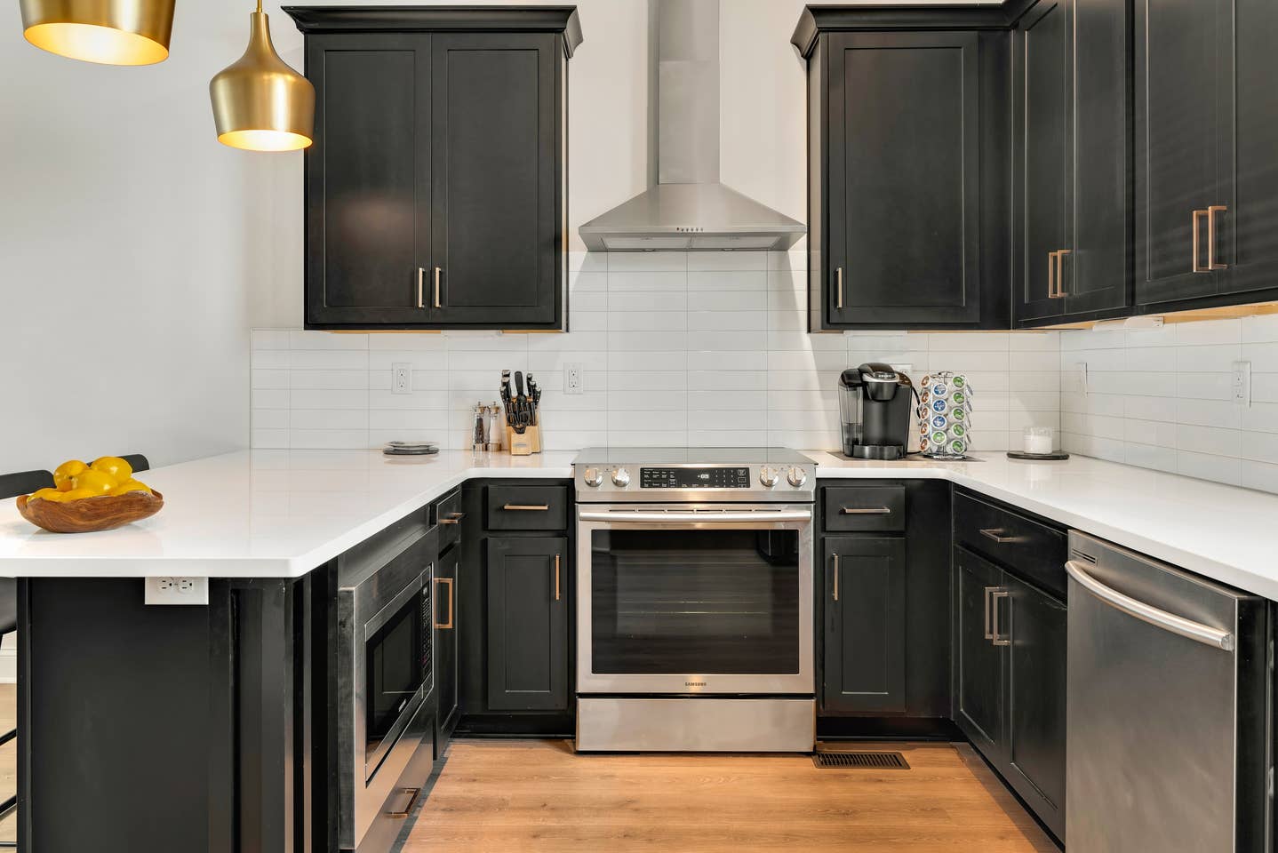 The kitchen has high-end stainless appliances and everything you need to prepare a meal.