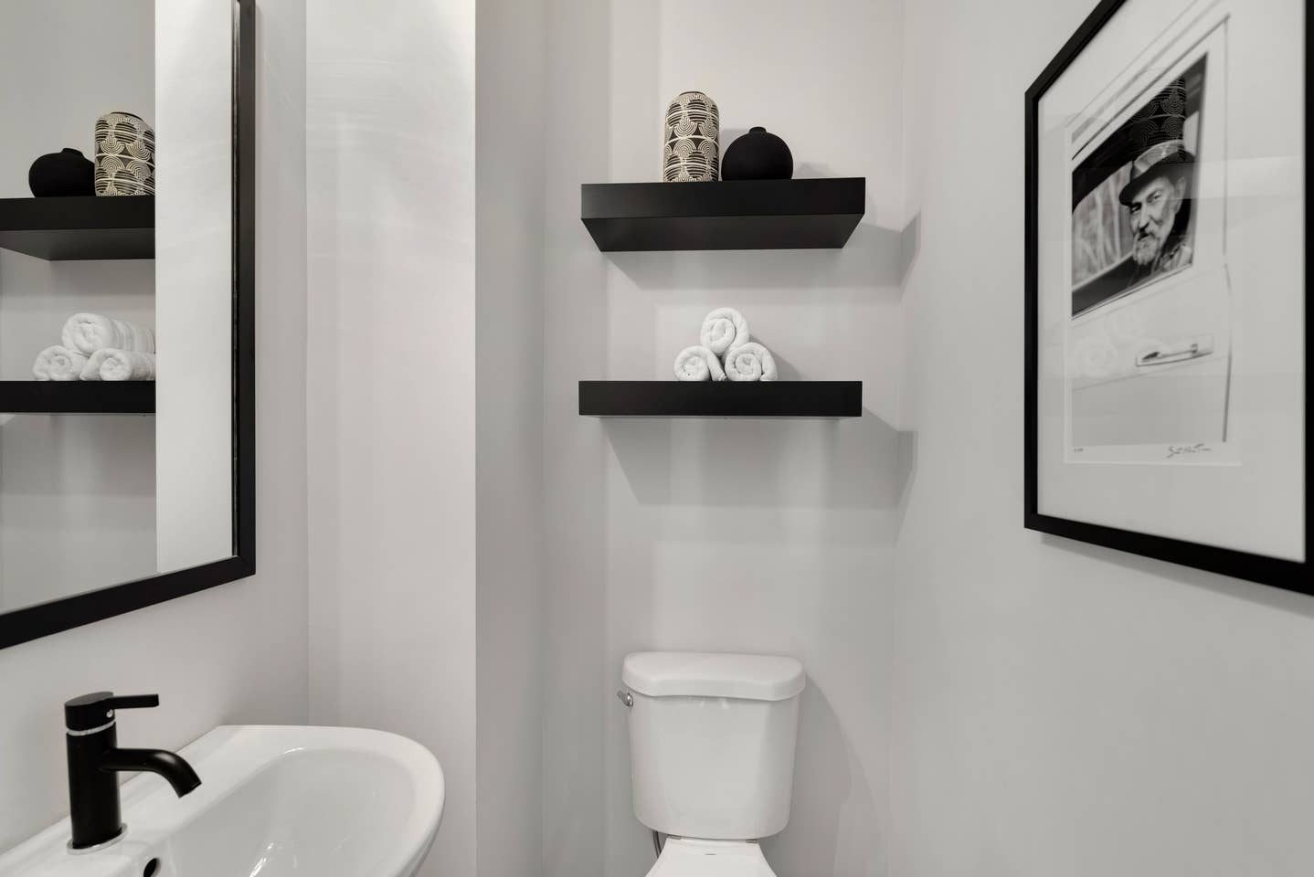 There's a 1/2 bath right at the top of the stairs