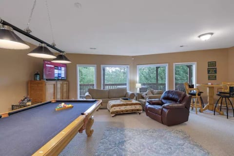 First floor, Pool table, Poker Table, Corn Hole, Large tv, Giant Jenga and games