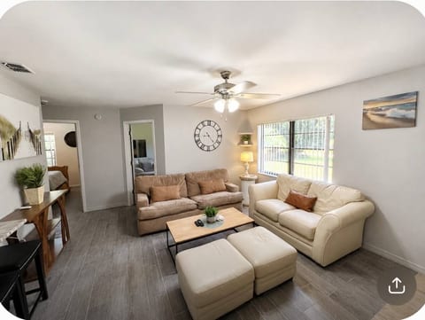 Bright and comfortable living room with a cozy seating area—perfect for relaxing, gathering, and enjoying time indoors.