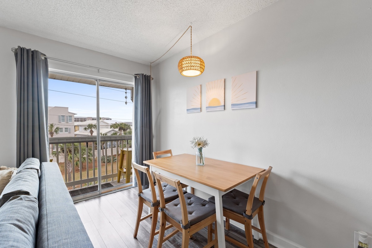 Dine with a view—seating for 4 beside the balcony, perfect for sunset meals and watching fireworks at night.