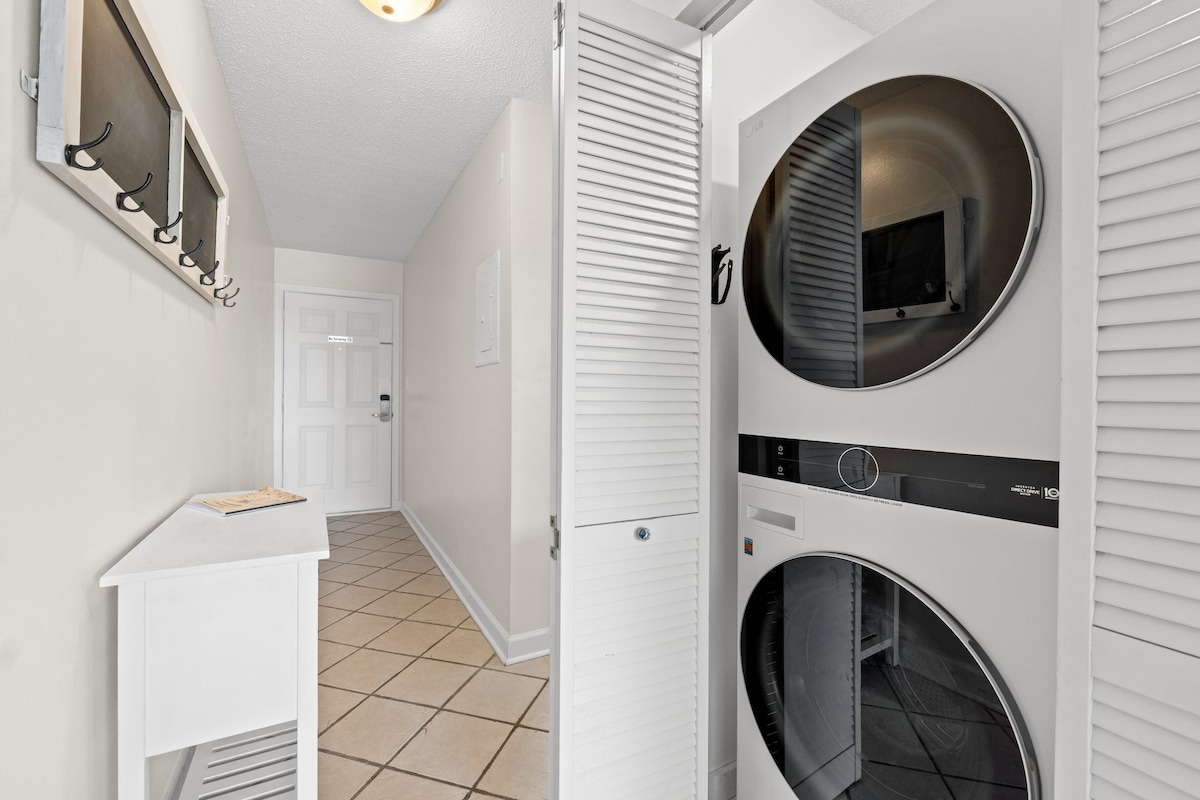 In-unit washer and dryer conveniently located just off the entryway for easy access during your stay.
