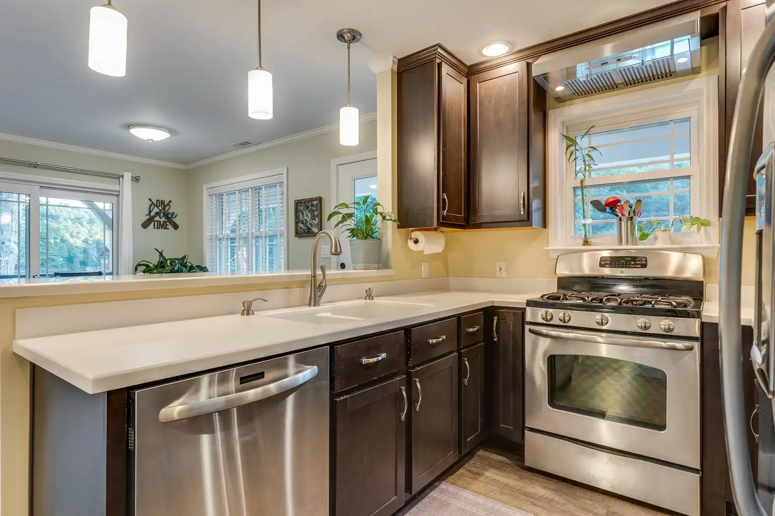 Dishwasher and bar top looking into dining area with lake view - Skipping Stones Getaway - Butler