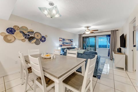 Open concept condo allows for different areas to cook, eat and relax while still being together.
