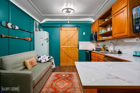Our cozy cabin is perfect for three adults or two adults and a couple of kids on the Serta sleeper sofa.