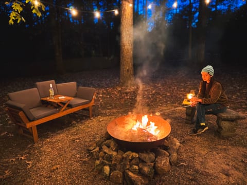 Campfires and carnival lights lend a certain magic to evenings at Clark's Cabin.