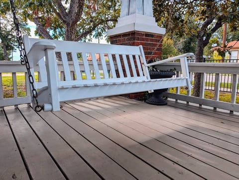 Enjoy a relaxing evening with a glass of wine or beer, listening to the birds and cicadas from our large, covered front porch. A porch swing and additional seats were recently added!