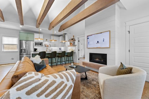 Stylish living area flowing seamlessly into the kitchen.
