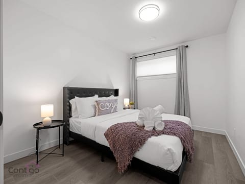 Enjoy restful nights in our queen bedroom with blackout curtains.