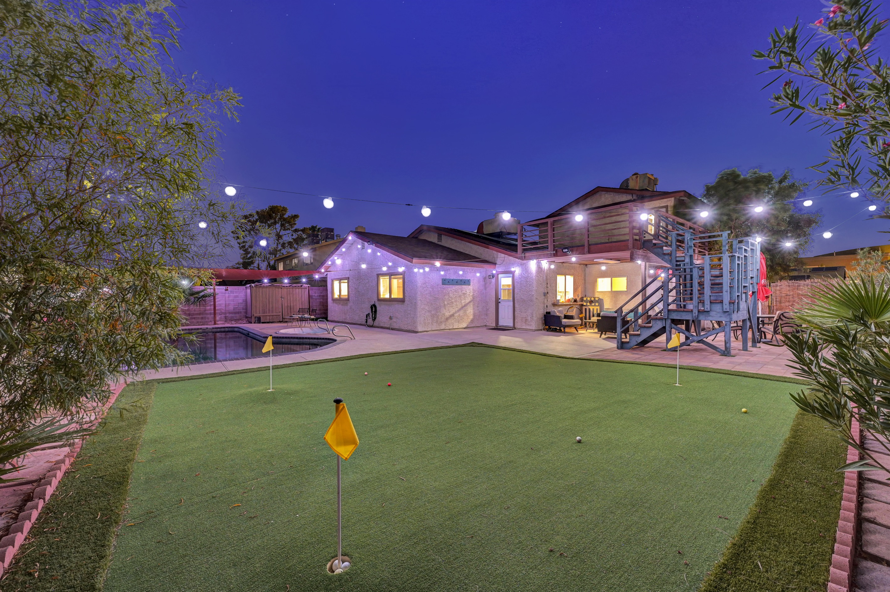 Shaded Pebble tec pool, patio, BBQ, Putting green, pool basketball, and games