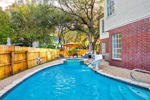 Welcome to your very own tropical oasis in San Antonio, Texas. Our stunning Sparkling Grecian Lazy Swimming Pool is the perfect place to escape the hustle and bustle of everyday life and relax in style. With a kids water slide and a deep octagon spa.