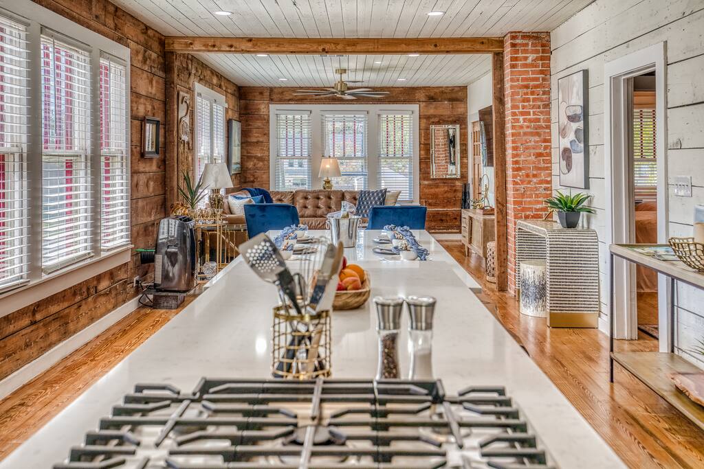 Fully stocked kitchen in an open space that is made for entertaining guests while you're blocks away from Downtown Brenham and all of it's events.