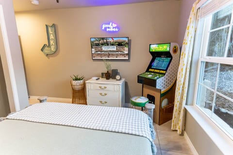 Lake-themed bedroom with neon accent + mini-arcade — cozy, fun, and uniquely yours.