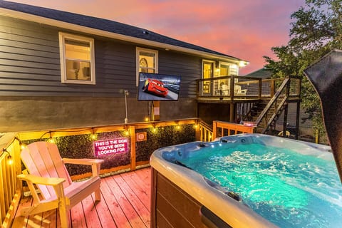 Soak in the hot tub while watching your favorite show on the outdoor TV — the perfect Canyon Lake evening